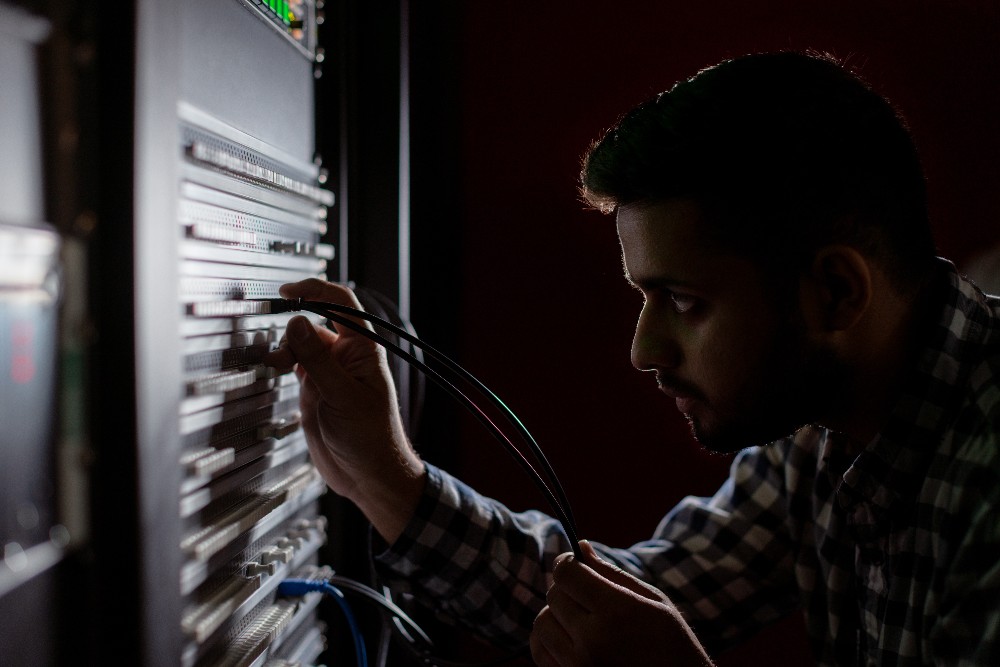 Male network engineer works in studio